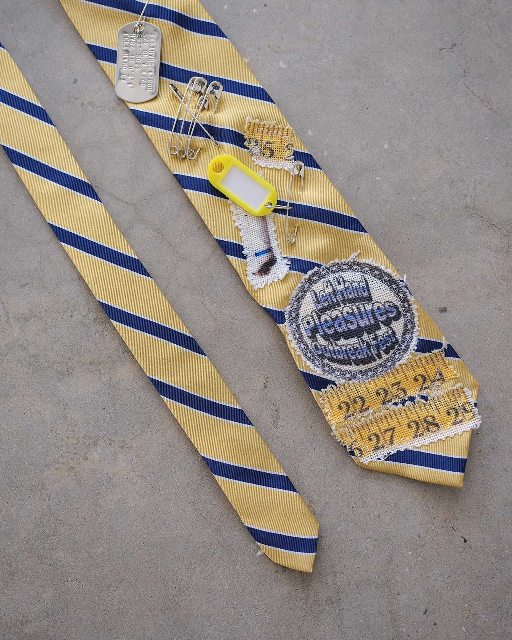 Yellow Tag Tie | PLEASURES x LeftHand LA x Outbreak® Outbreak Fest Outbreak®