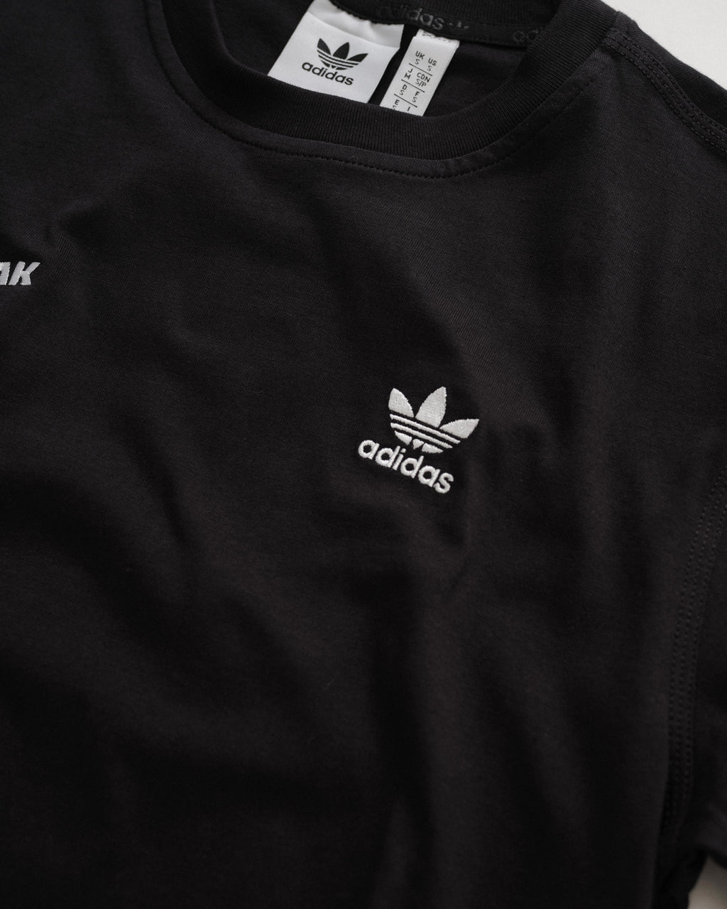 Outbreak® x adidas Essentials T-Shirt